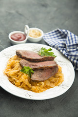 Beef fillet serves with sauerkraut