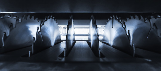 Circular saws inside equipment tool machine, Abstract industrial and woodwork background, toned,...