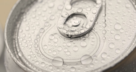 Can of beer in drops of water