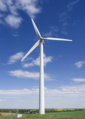 Fototapeta premium Wind Energy: Three bladed wind turbine in the rural Altenburg County on a beautiful day in April