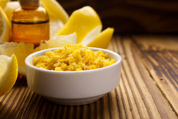 Lemon essential oil on a wooden background