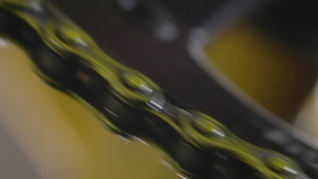 Bike's Chain, Chain from the Bike Shot in the Macro Lens, Yellow Chain, Close-Up, Movement