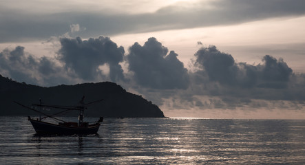 Fototapeta na wymiar Fishing boats parked in calm sea