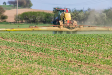 Spring chemical treatment of cereals with blurred machine
