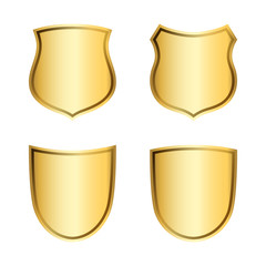Gold shield shape icons set. 3D golden emblem signs isolated on white background. Symbol of security, power, protection. Badge shape shield graphic design. Vector illustration