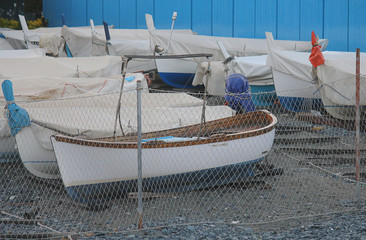 covered boats on the beach