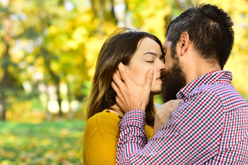 Girl and bearded guy or happy lovers on date kiss