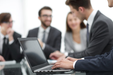 Hands of business man working on laptop.