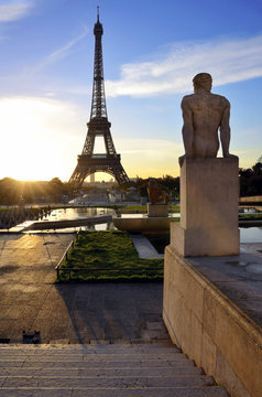 Eiffel tower. Paris. France. Statue and sunrise.