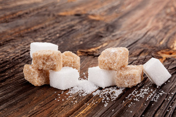 Brown and white crystal sugar cubes.