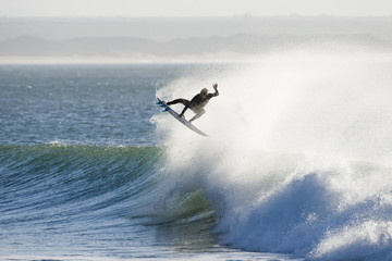 A surfer takes to the air during a free surf