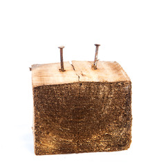 Big old dark cube is cut out from old wood. Isolated on white