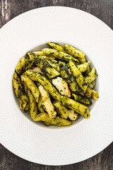 Pasta with pesto sauce and nuts on a the table