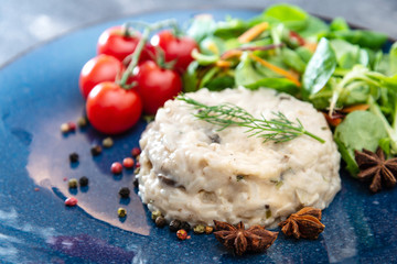 risotto with fresh cream, salted chicken, rehydrated ceps and mushrooms