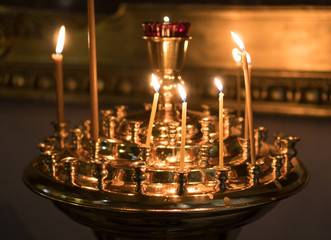 Fototapeta premium Metal candle light cresset in church.