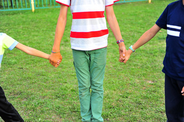 Three kids playing in the park