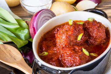 Juicy Meatballs with Tomato Sauce and Ingredients for Cooking