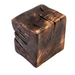 Big old dark cube is cut out from old wood. Isolated on white