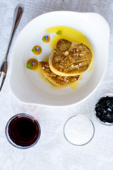 Fried Goose Liver with Apple Sauce on White Plate. Foie Gras Fine Food.