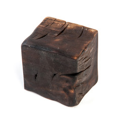 Big old dark cube is cut out from old wood. Isolated on white