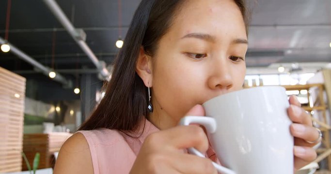 Teenage girl drinking coffee 