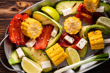 Grilled vegetables, corn cobs, zucchini, red pepper.