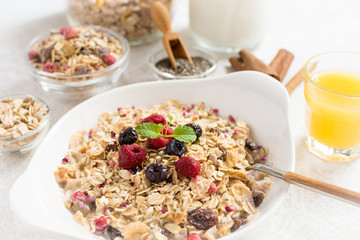 Muesli With Milk, Chia Seeds, Berries and Cinnamon with Freshly Squeezed Orange Juice
