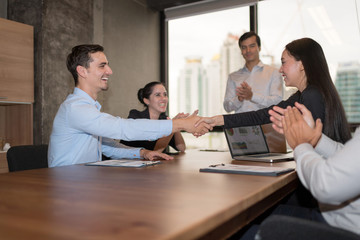 Business partners shaking hand after complete a deal. Business people handshaking.Corporation Organization Success Teamwork Concept.