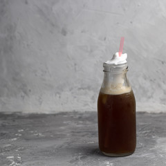 iced coffee jar gray stone background