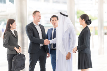 Confident and Active Businesspersons Creative Business Meeting Outdoor.Startup Running The New Project Plan.Young Exusive Arabian Businessmen Making Handshake , Dealing, Merger and Acquisition Concept