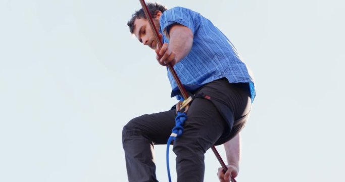 Highline athlete balancing on slack line tight rope 