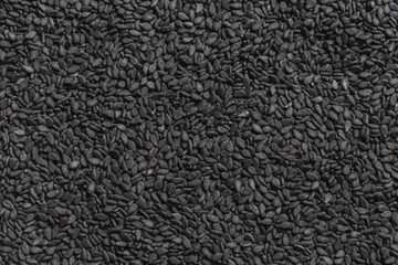 Ziarna czarnego sezamu. Tło z czarnych ziaren. tekstura z czarnych nasion.