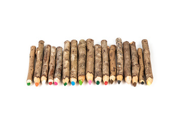 Handmade wooden color pencils on white background.