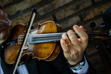 Violinist playing in small presentation. The violin is one of the instruments that represent...