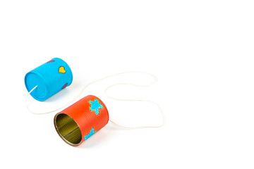 Colourful hand painted can telephone on white background.