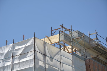 building under construction with scaffolding