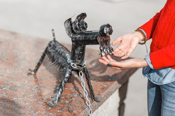  Woman touch cuty little statue of a dog