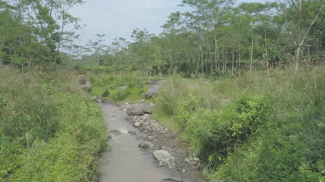 Aerial footage tracking in small river, Ledok Sambi village, Yogyakarta, Indonesia. April 2018