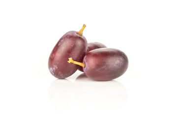 Red globe grape stack three berries isolated on white background.