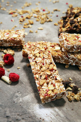 Granola bar. Healthy sweet dessert snack. Cereal granola bar with nuts, fruit and berries