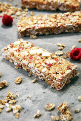 Granola bar. Healthy sweet dessert snack. Cereal granola bar with nuts, fruit and berries