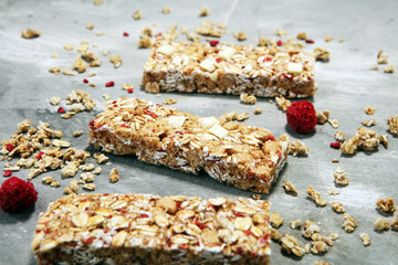 Granola bar. Healthy sweet dessert snack. Cereal granola bar with nuts, fruit and berries