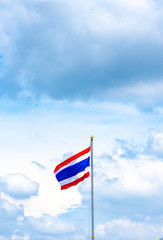 A flag is in the sky and clouds and beautiful