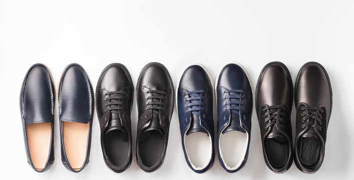 Several Men's Pair Of Shoes On White Background