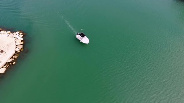 The boat is floating in the sea View from the drone