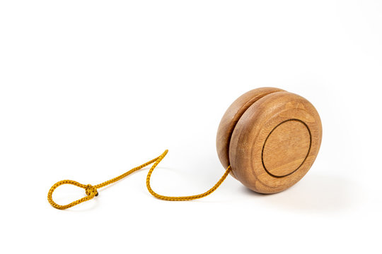 A wooden yo-yo on white background.