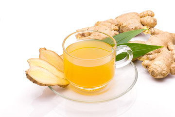 Hot ginger ale, ginger beer in glass with ginger slice on white background,,Herb and spice