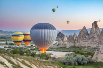 Start hot air balloons early in the morning at dawn over the village of Kayseri, Cappadocia, Turkey