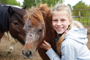 Pony and horsewoman - little girl and her best friend