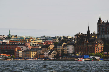 Cityscape view of Stockholm’s old town in famous Gamla Stan area densely situated by archaic buildings influenced by North German architecture
